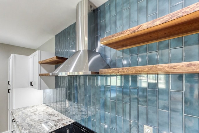 kitchen featuring white cabinets and extractor fan