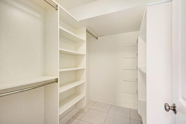 walk in closet featuring light tile patterned floors