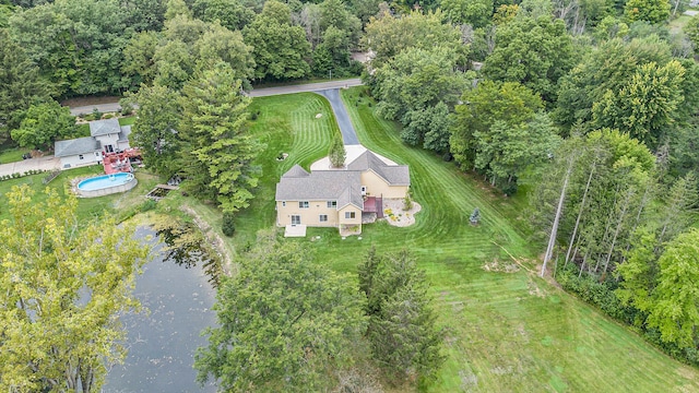 birds eye view of property with a water view