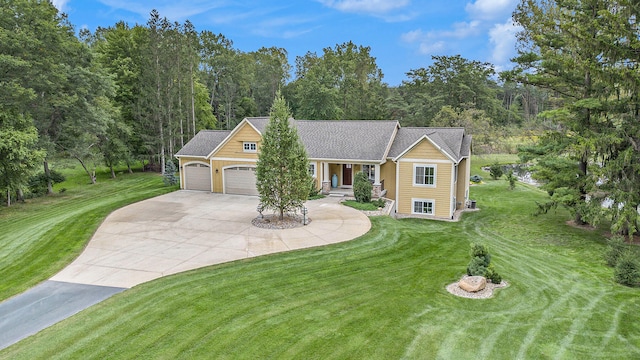 view of front of house with a garage and a front lawn