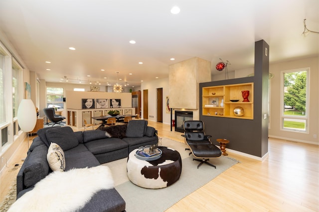 12737 Sanctuary Pl, Grand Haven, MI 49417 - living area with light wood-type flooring, recessed lighting, and baseboards