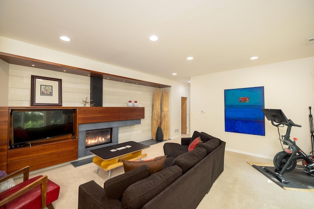 12737 Sanctuary Pl, Grand Haven, MI 49417 - carpeted living area featuring a glass covered fireplace, recessed lighting, and baseboards
