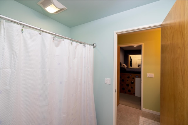 12737 Sanctuary Pl, Grand Haven, MI 49417 - bathroom featuring tile patterned floors and curtained shower