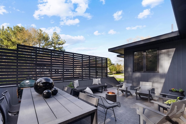 12737 Sanctuary Pl, Grand Haven, MI 49417 - view of patio / terrace with an outdoor living space with a fire pit and outdoor dining area
