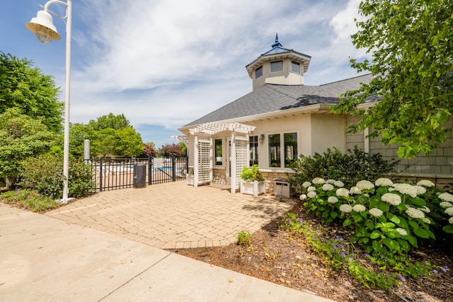 exterior space featuring a pergola