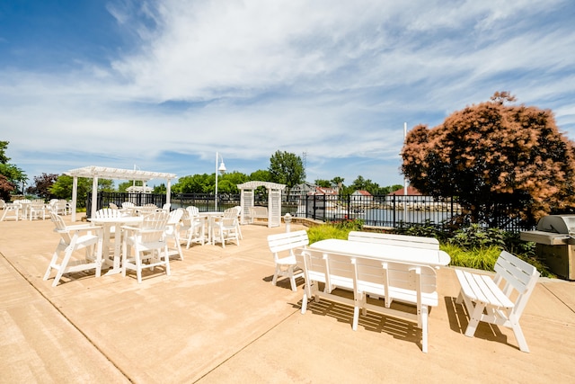 view of patio featuring a pergola and a grill