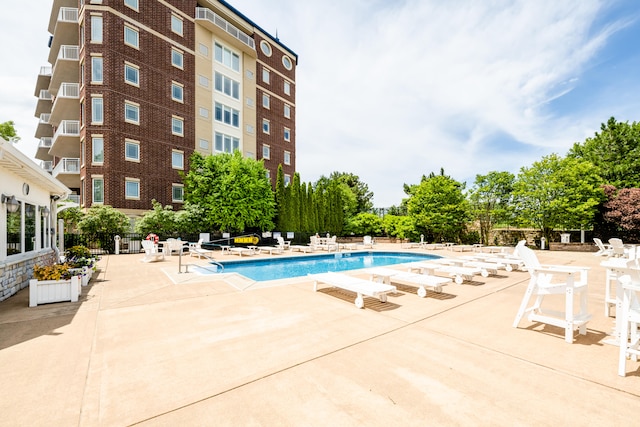 view of swimming pool featuring a patio