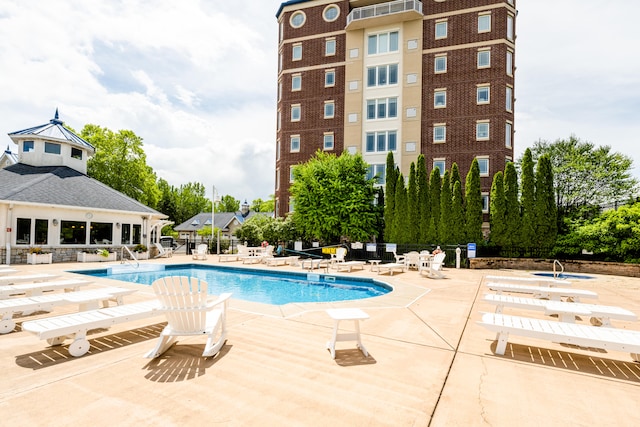 view of swimming pool with a patio area