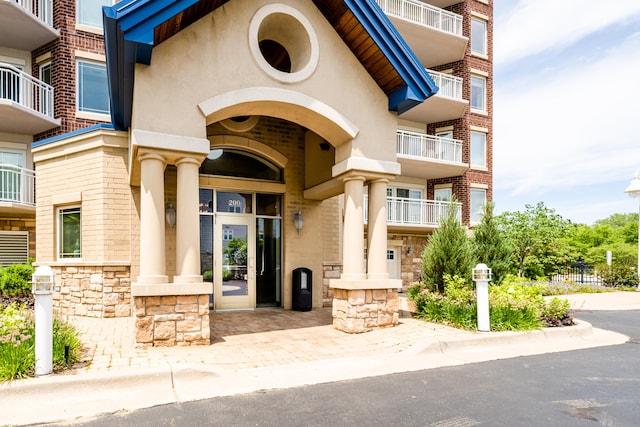 entrance to property with a balcony