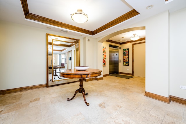 interior space featuring elevator, a raised ceiling, ornamental molding, and light tile patterned floors