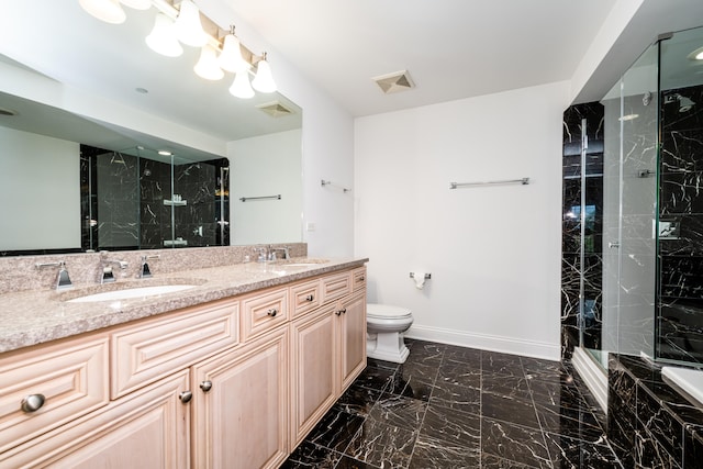 bathroom featuring tile patterned flooring, toilet, and dual bowl vanity