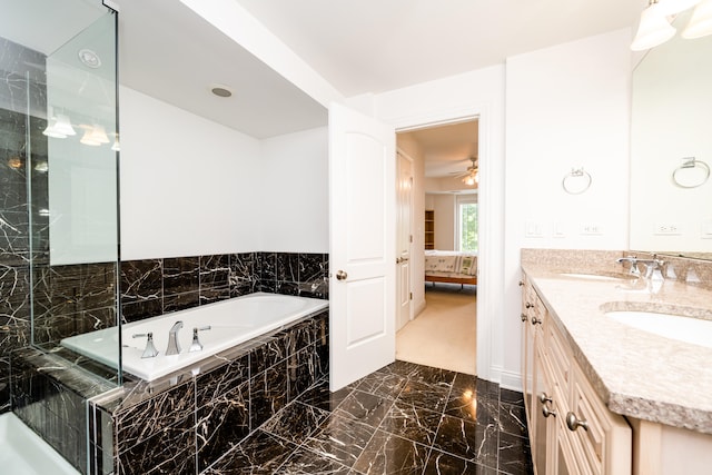 bathroom with plus walk in shower, tile patterned floors, double sink vanity, and ceiling fan