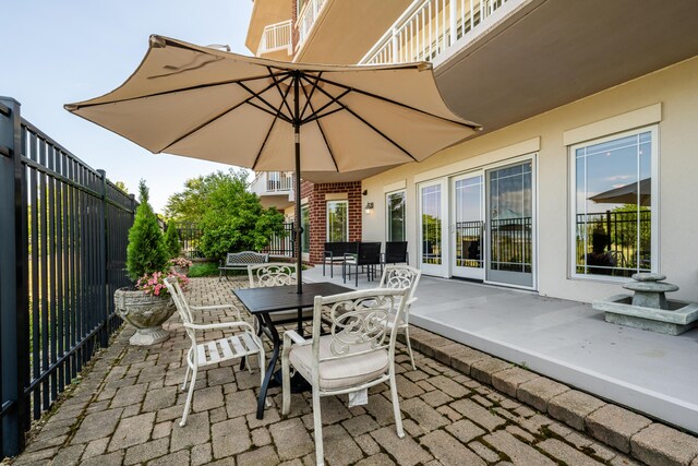 view of patio featuring outdoor dining area and a fenced backyard