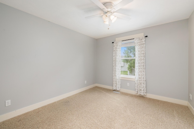 carpeted empty room with ceiling fan