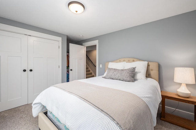 carpeted bedroom with a closet