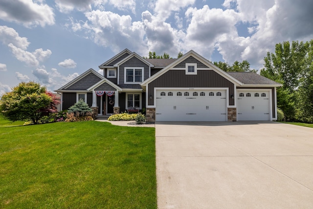 craftsman-style home with a garage and a front lawn