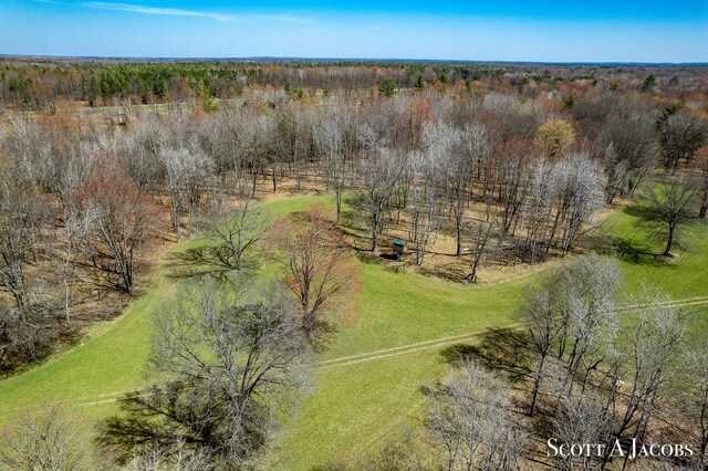 birds eye view of property with a rural view