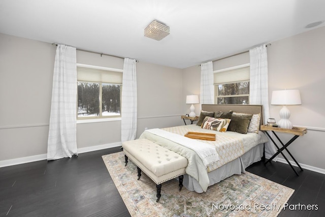 bedroom with dark wood-type flooring