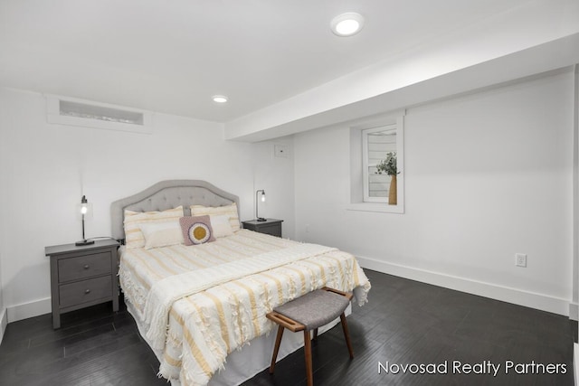 bedroom with dark wood-type flooring