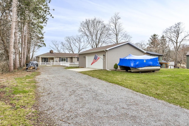 ranch-style house featuring an attached garage, a chimney, a front yard, and gravel driveway