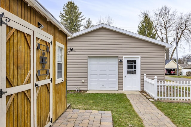 garage featuring fence