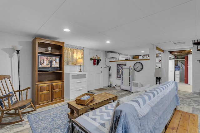 living area with recessed lighting, light wood-type flooring, and a wall unit AC