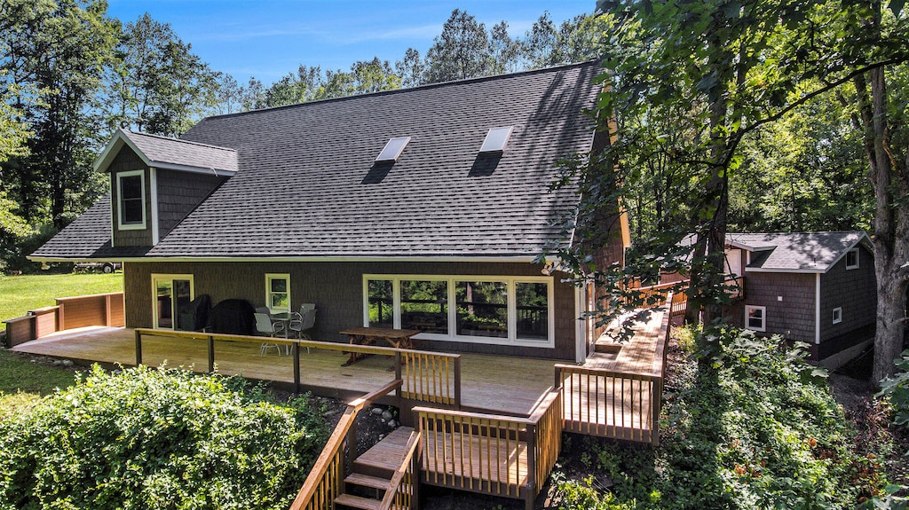 rear view of house with a deck