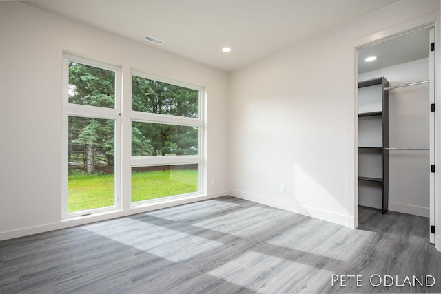 empty room featuring hardwood / wood-style flooring