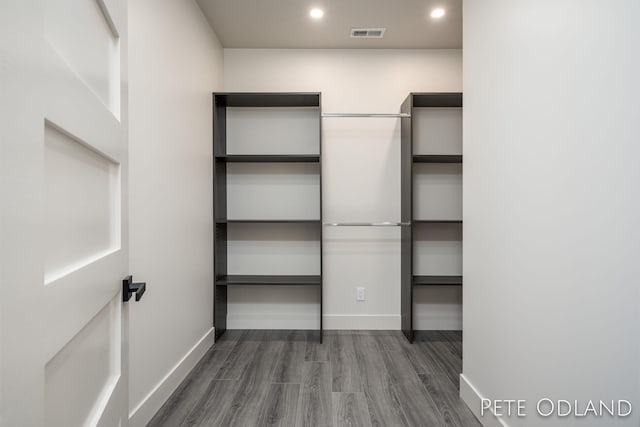 walk in closet featuring dark hardwood / wood-style flooring