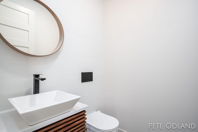 bathroom with vanity and toilet