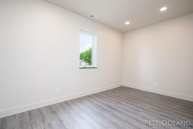 unfurnished room featuring wood-type flooring