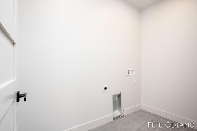 laundry area with washer hookup, light tile patterned floors, and electric dryer hookup