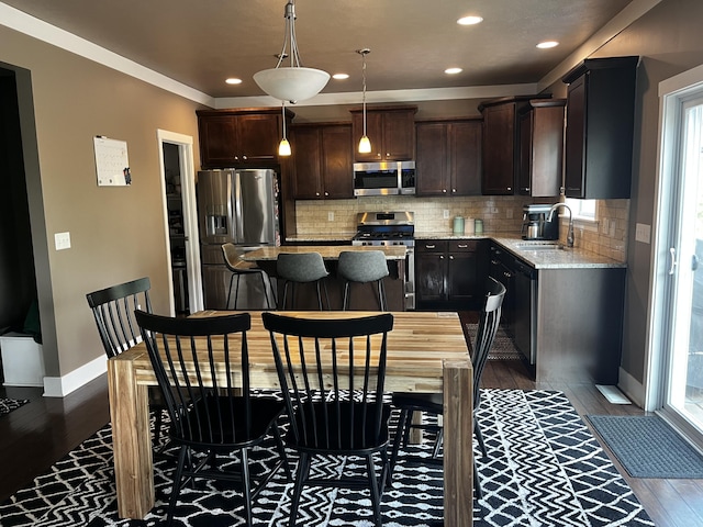 727 Wild Flower Ct, Wayland, MI 49348 - kitchen featuring appliances with stainless steel finishes, wood finished floors, recessed lighting, and healthy amount of natural light