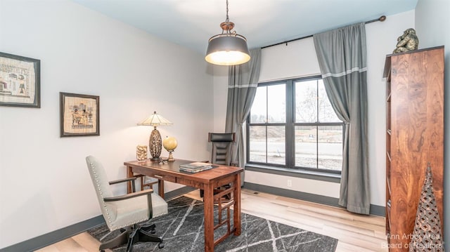 office space with light hardwood / wood-style floors