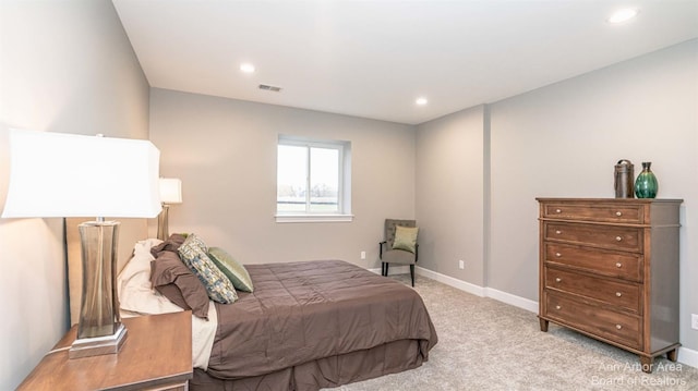 bedroom with light carpet