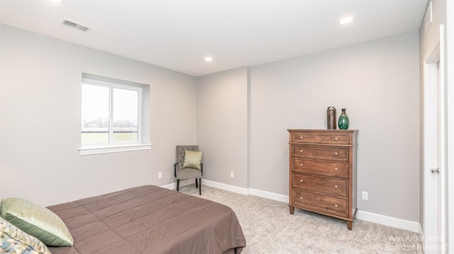 bedroom featuring light colored carpet