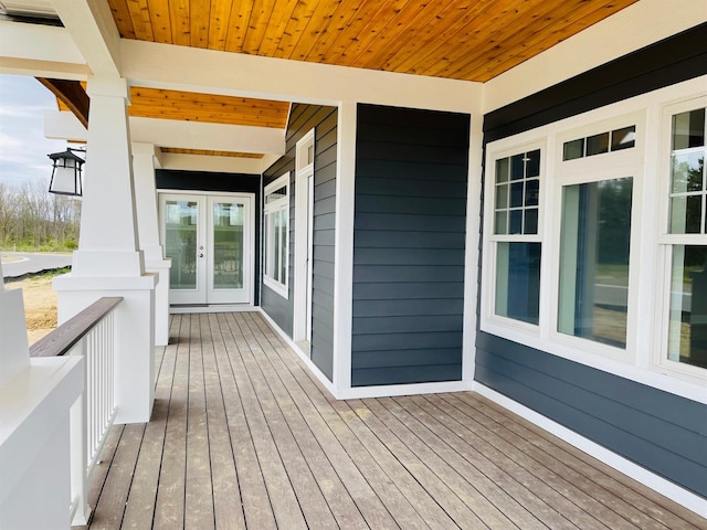 wooden terrace featuring french doors