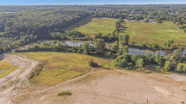 drone / aerial view featuring a water view and a rural view