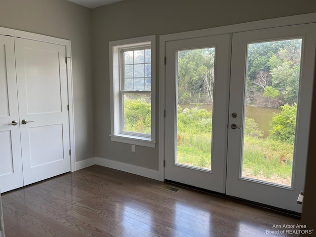 doorway to outside with hardwood / wood-style floors and french doors