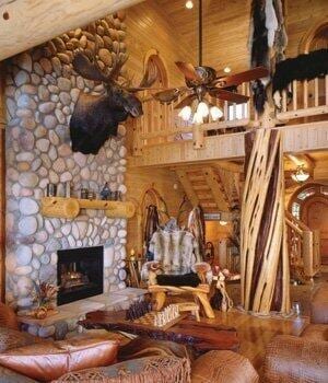 unfurnished living room with a high ceiling, ceiling fan, and a fireplace