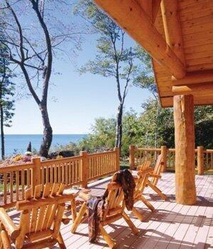 wooden terrace featuring a water view