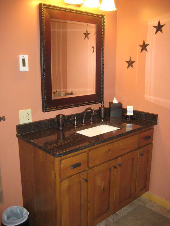 bathroom with vanity and baseboards