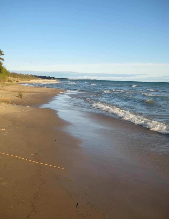 property view of water featuring a view of the beach