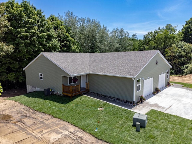 ranch-style home with a front yard and a garage