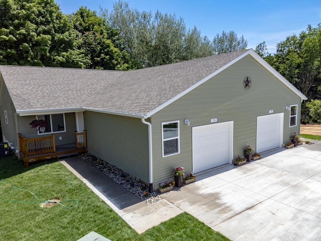 view of front facade with a front yard and a garage