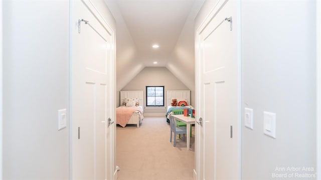 carpeted bedroom featuring vaulted ceiling