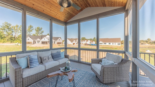 sunroom featuring wood ceiling, ceiling fan, plenty of natural light, and vaulted ceiling