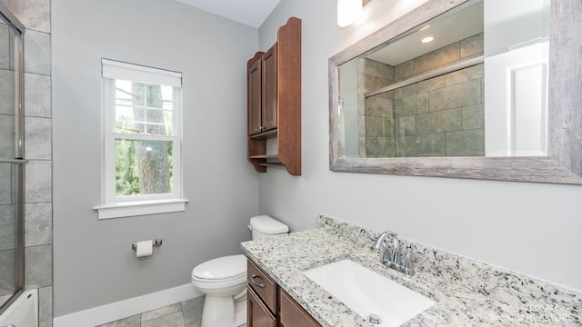 full bathroom featuring tile patterned flooring, vanity, plenty of natural light, and toilet