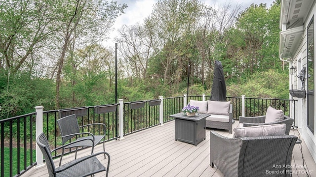 wooden terrace featuring outdoor lounge area