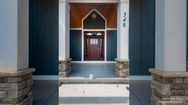 view of exterior entry featuring a porch